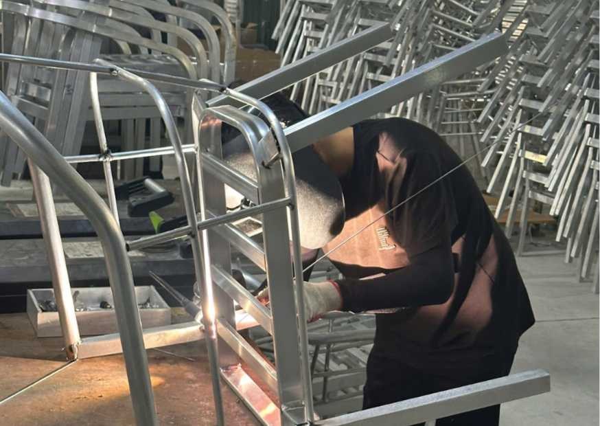 Welding a curved aluminum frame for outdoor furniture production