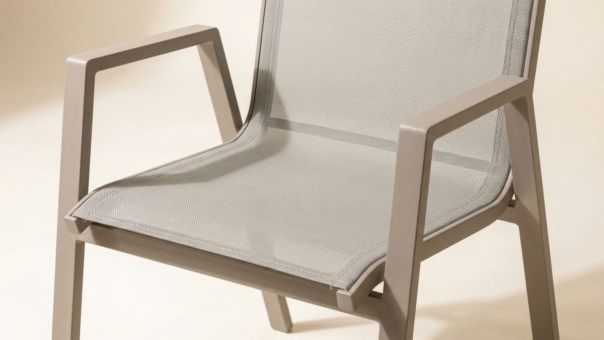 Close-up of tensioned Textilene seat and backrest on an aluminum outdoor chair