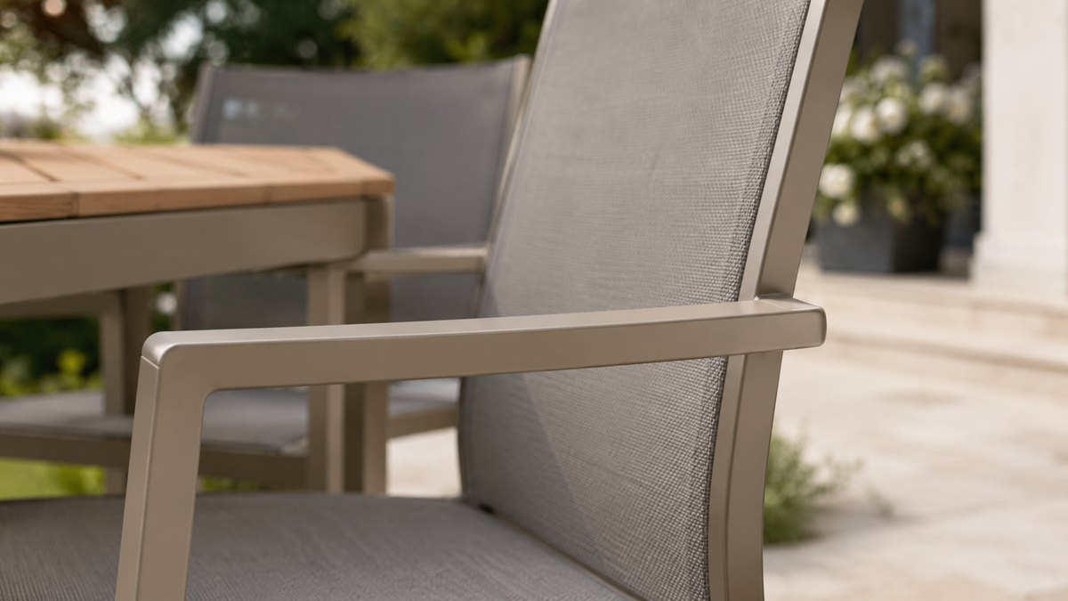 Close-up of a powder-coated aluminum outdoor chair frame and Textilene backrest