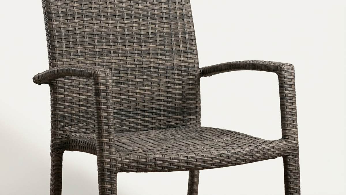 Close-up of dense PP rattan weaving on an outdoor armchair