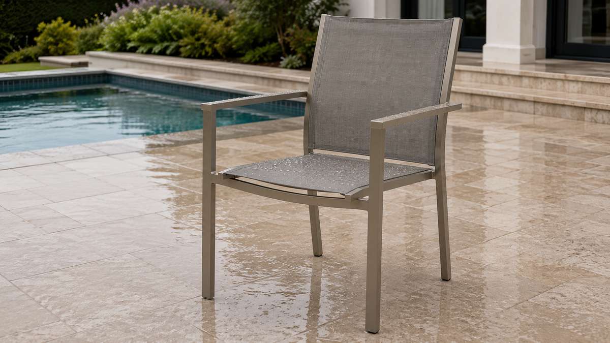 Quick-drying Textilene patio chair beside a swimming pool after rain